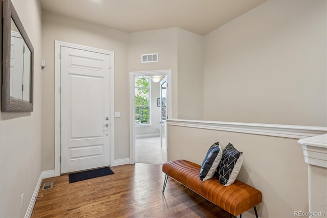 entrance foyer with wood finished floors and baseboards