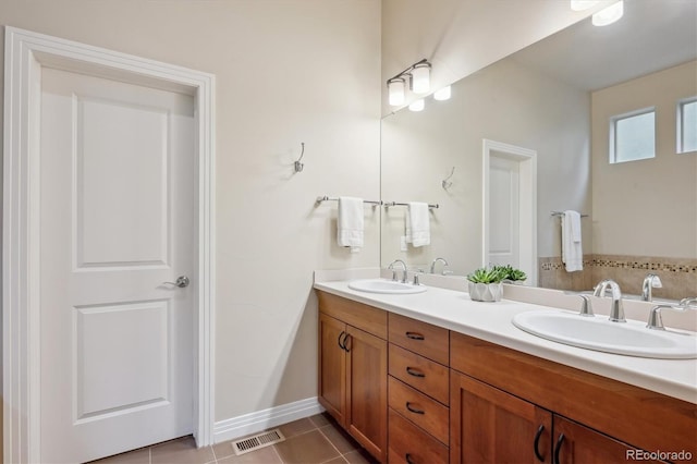 full bath featuring double vanity and tile patterned floors