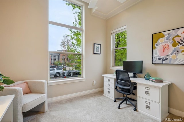 office space featuring light colored carpet and baseboards