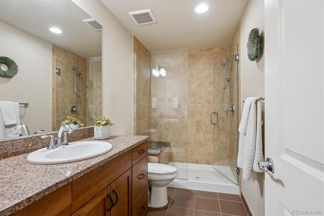 full bath with a shower stall, tile patterned floors, vanity, toilet, and recessed lighting