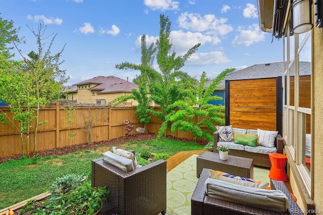 fenced backyard featuring outdoor lounge area