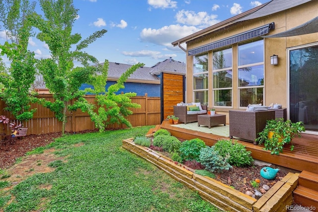 view of yard featuring an outdoor hangout area and a deck