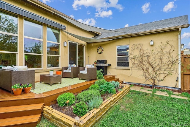 rear view of house featuring an outdoor hangout area, a wooden deck, stucco siding, a shingled roof, and a lawn