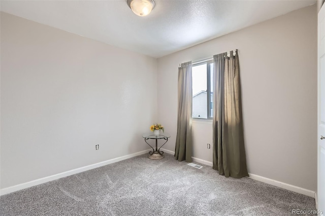 unfurnished room with carpet floors