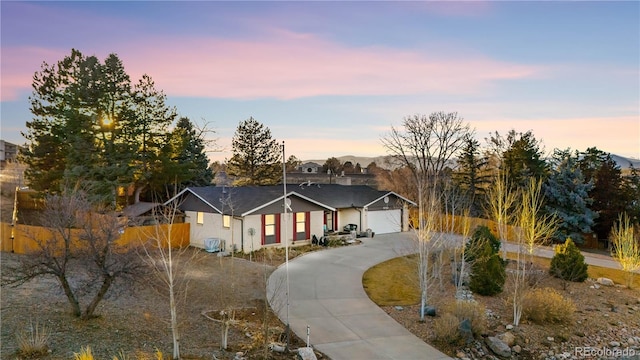 single story home featuring a garage