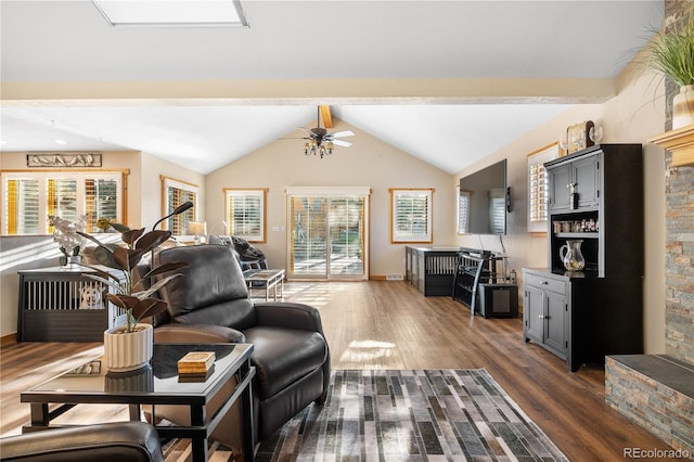 living room with lofted ceiling with beams, dark wood-type flooring, and ceiling fan