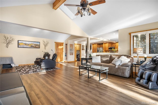 living room with high vaulted ceiling, washer / clothes dryer, beamed ceiling, hardwood / wood-style flooring, and ceiling fan