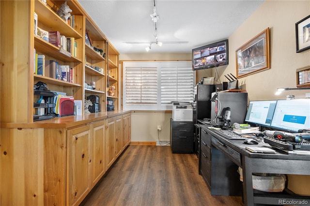 office with dark hardwood / wood-style floors and rail lighting