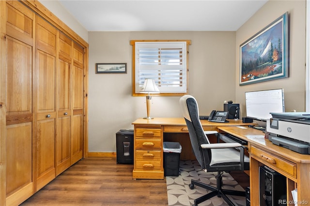 home office with wood-type flooring