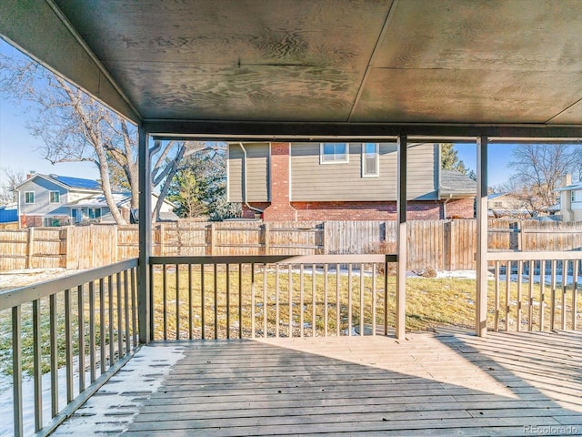 wooden deck featuring a yard