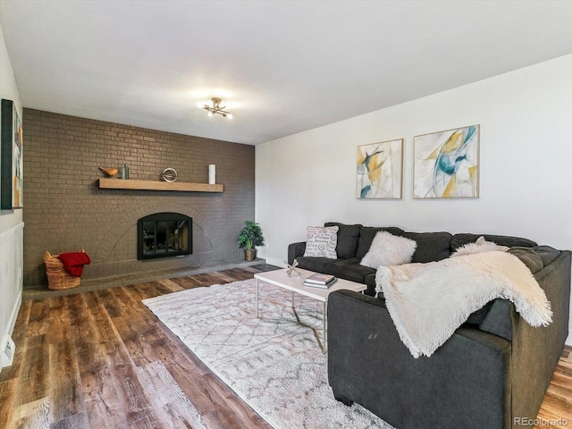 living room featuring a fireplace and dark hardwood / wood-style floors