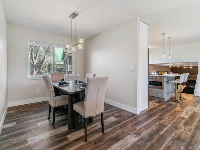 dining space featuring dark wood-type flooring