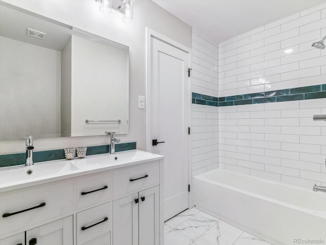 bathroom with vanity and  shower combination