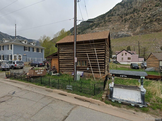 view of side of home featuring a mountain view