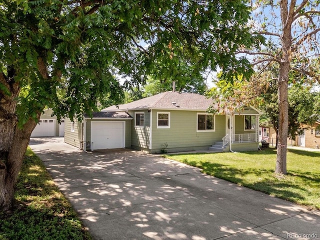 4125 Pierce St, Wheat Ridge, CO 80033 - single story home with an attached garage, driveway, a front lawn, and a shingled roof