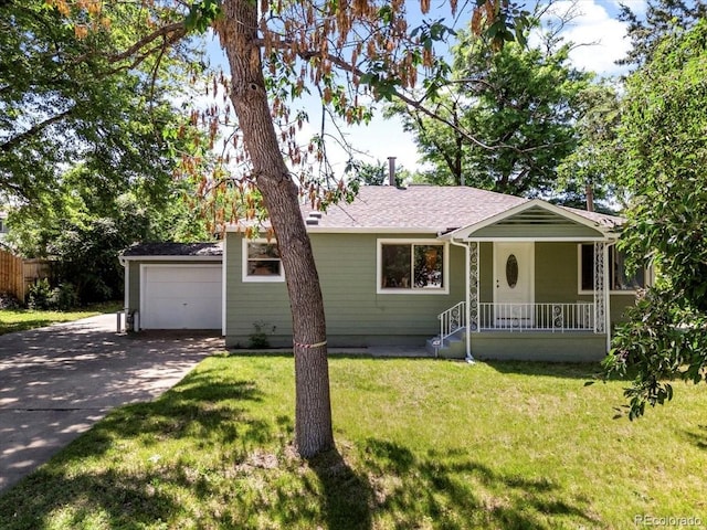 4125 Pierce St, Wheat Ridge, CO 80033 - ranch-style house featuring concrete driveway, a porch, a garage, a front lawn, and a shingled roof