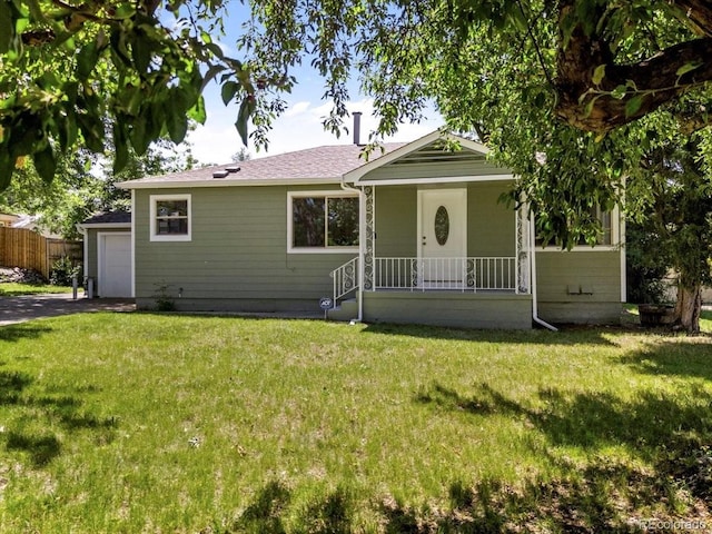 4125 Pierce St, Wheat Ridge, CO 80033 - view of front of property with an attached garage and a porch