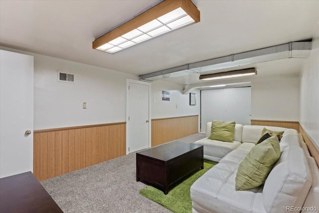 4125 Pierce St, Wheat Ridge, CO 80033 - carpeted living area featuring wood walls and a wainscoted wall