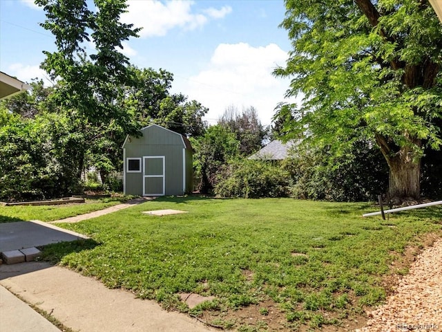 4125 Pierce St, Wheat Ridge, CO 80033 - view of grassy yard featuring a shed