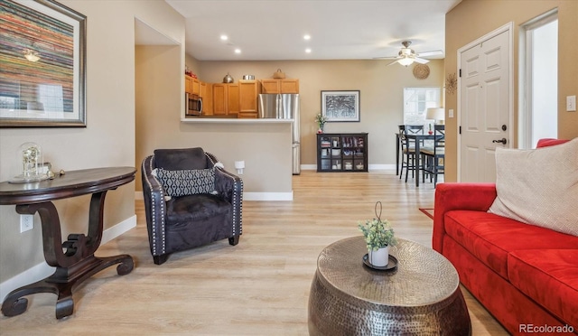 3847 Mossy Rock Dr Unit 104, Highlands Ranch, CO 80126 - living area featuring light wood finished floors, a ceiling fan, baseboards, and recessed lighting