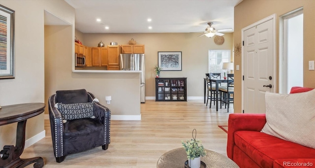 3847 Mossy Rock Dr Unit 104, Highlands Ranch, CO 80126 - living room featuring a ceiling fan, light wood finished floors, recessed lighting, and baseboards