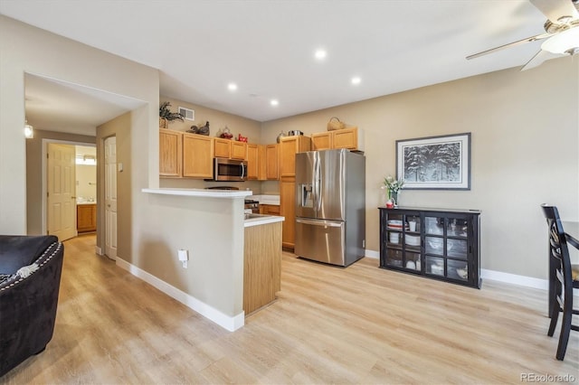 3847 Mossy Rock Dr Unit 104, Highlands Ranch, CO 80126 - kitchen with appliances with stainless steel finishes, a ceiling fan, light wood-type flooring, baseboards, and light countertops