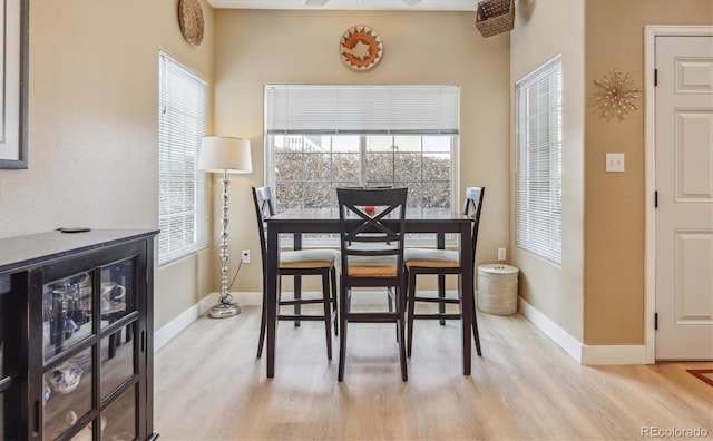 3847 Mossy Rock Dr Unit 104, Highlands Ranch, CO 80126 - dining area featuring light wood finished floors and baseboards