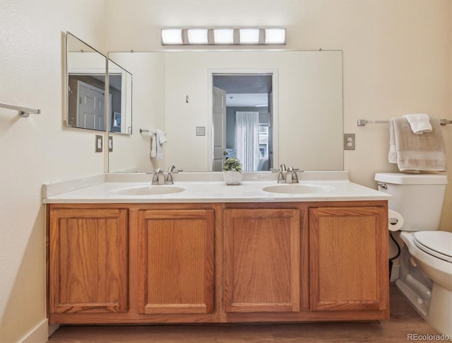 3847 Mossy Rock Dr Unit 104, Highlands Ranch, CO 80126 - full bathroom with toilet and double vanity