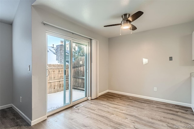 spare room featuring ceiling fan and light wood-type flooring