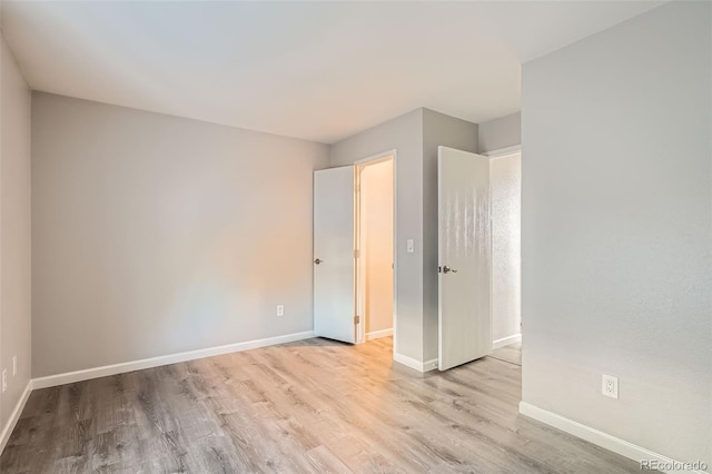 spare room featuring light wood-type flooring