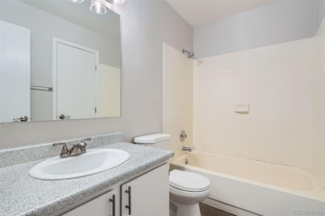 full bathroom with vanity, toilet, and  shower combination