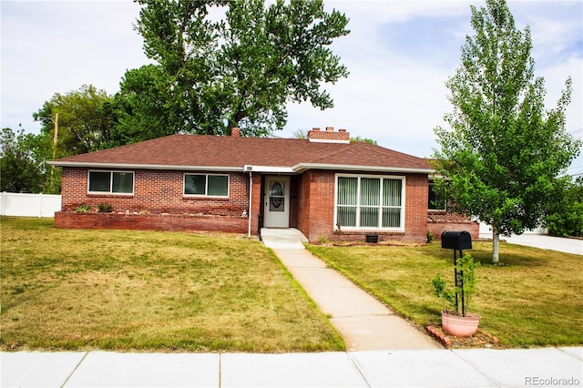 820 Walnut St, Julesburg, CO 80737 - ranch-style home featuring brick siding, a chimney, and roof with shingles