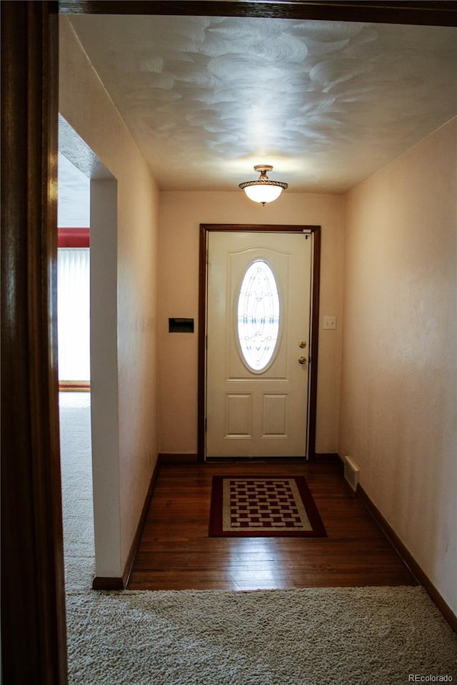 820 Walnut St, Julesburg, CO 80737 - entryway with baseboards and wood finished floors