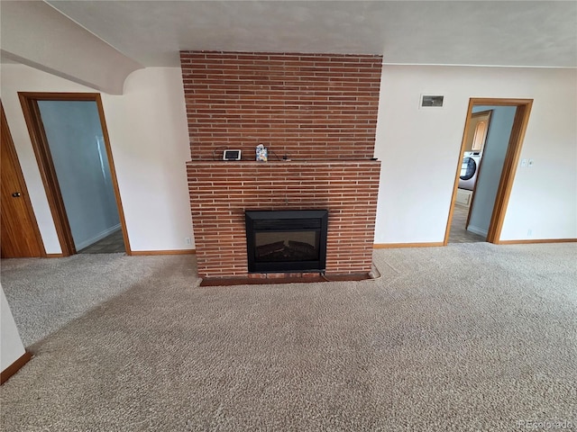 820 Walnut St, Julesburg, CO 80737 - unfurnished living room featuring carpet, baseboards, and vaulted ceiling