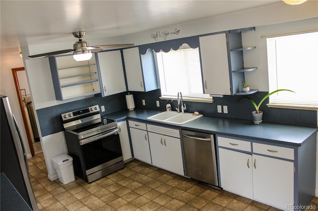 820 Walnut St, Julesburg, CO 80737 - kitchen featuring stainless steel appliances, a sink, dark countertops, open shelves, and ceiling fan