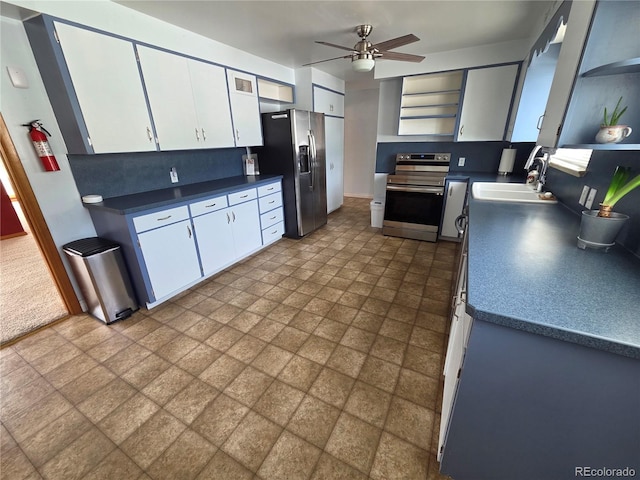 820 Walnut St, Julesburg, CO 80737 - kitchen with stainless steel appliances, open shelves, a sink, and ceiling fan