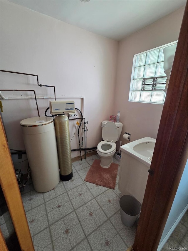 820 Walnut St, Julesburg, CO 80737 - bathroom featuring toilet, tile patterned floors, and vanity