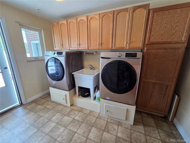 820 Walnut St, Julesburg, CO 80737 - washroom featuring washer / dryer, cabinet space, stone finish flooring, and baseboards