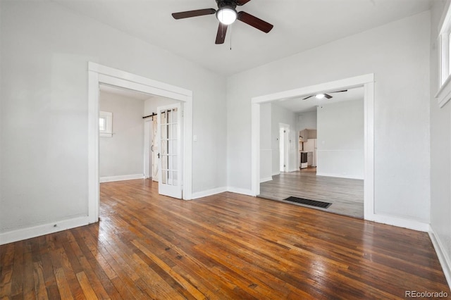 4046 S Bannock St, Englewood, CO 80110 - empty room with wood-type flooring, ceiling fan, visible vents, and baseboards