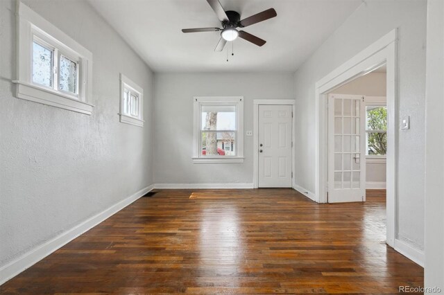 4046 S Bannock St, Englewood, CO 80110 - empty room featuring wood finished floors, a textured wall, baseboards, and a ceiling fan