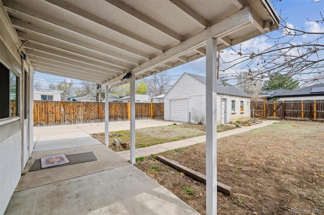 4046 S Bannock St, Englewood, CO 80110 - view of patio featuring an outbuilding and a fenced backyard