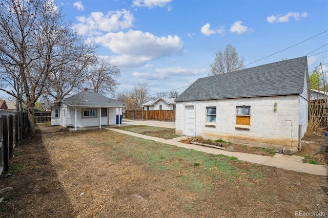 4046 S Bannock St, Englewood, CO 80110 - exterior space featuring a fenced backyard and an outdoor structure