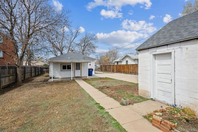 4046 S Bannock St, Englewood, CO 80110 - exterior space with a fenced backyard and an outdoor structure