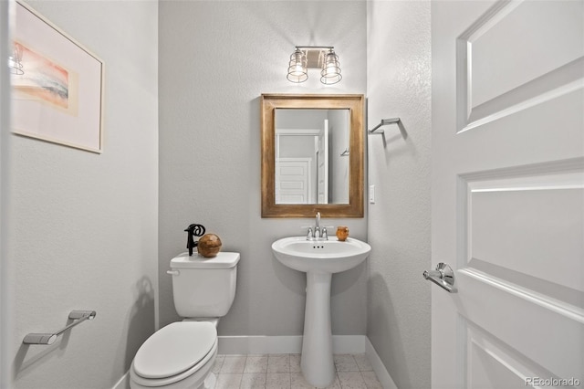6700 Clay St, Denver, CO 80221 - bathroom with toilet and tile patterned floors