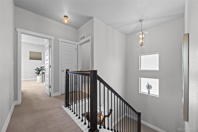 6700 Clay St, Denver, CO 80221 - hall featuring an upstairs landing and light carpet