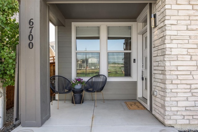 6700 Clay St, Denver, CO 80221 - doorway to property with brick siding and covered porch