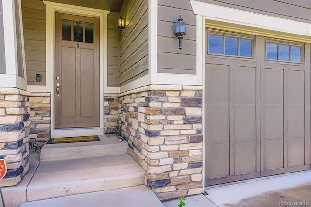 12631 Glencoe St, Thornton, CO 80241 - doorway to property with stone siding and covered porch
