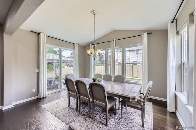 12631 Glencoe St, Thornton, CO 80241 - dining room featuring a chandelier, lofted ceiling, and dark wood-style floors
