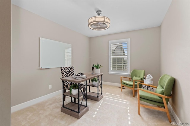 home office with light colored carpet and baseboards