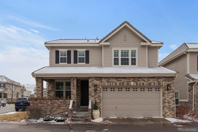 traditional-style home with a garage, a tiled roof, and brick siding